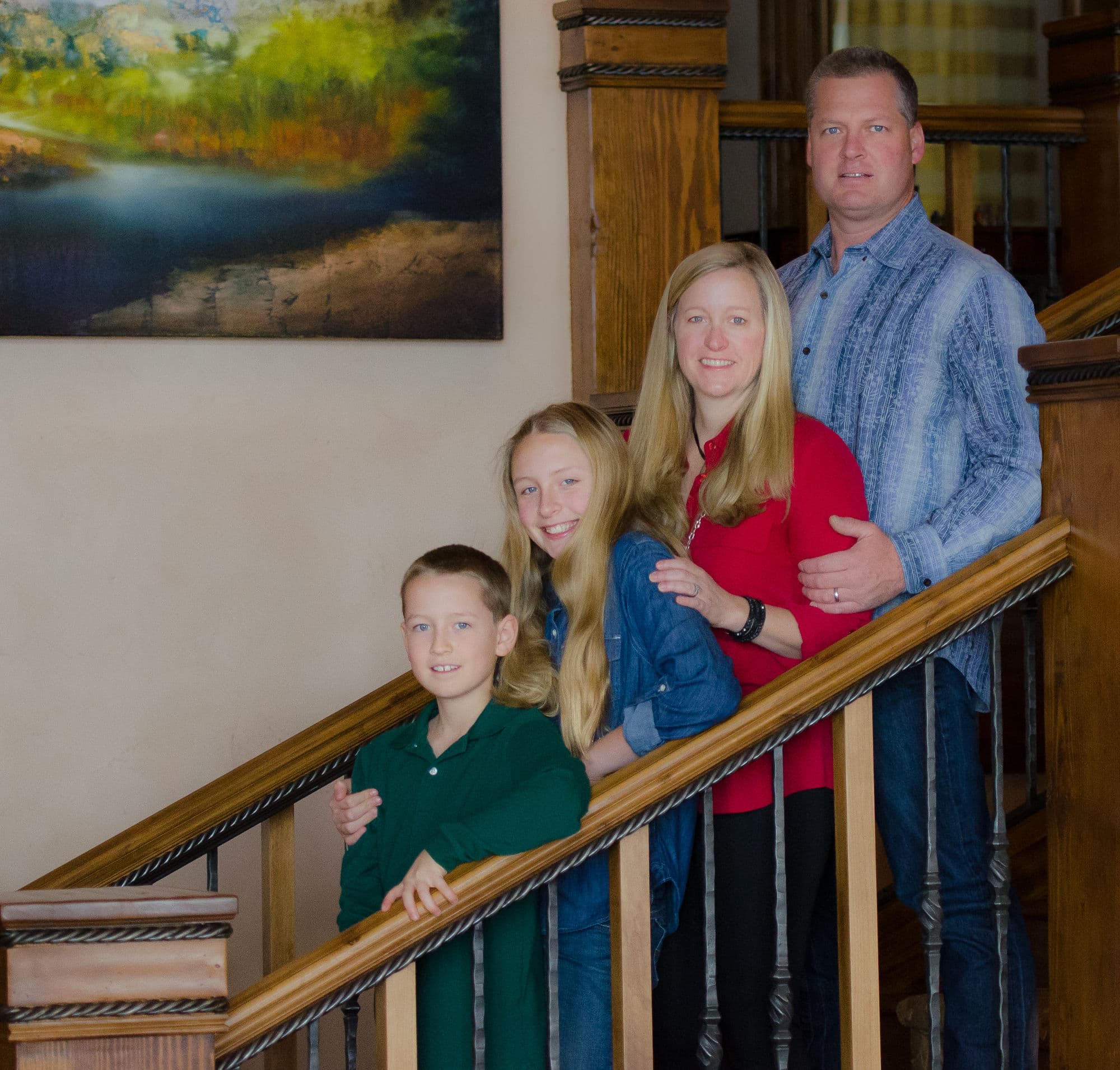 Krista and Matt Behr, owners of Mountain Style Window Coverings, with their family in their Vail Valley home